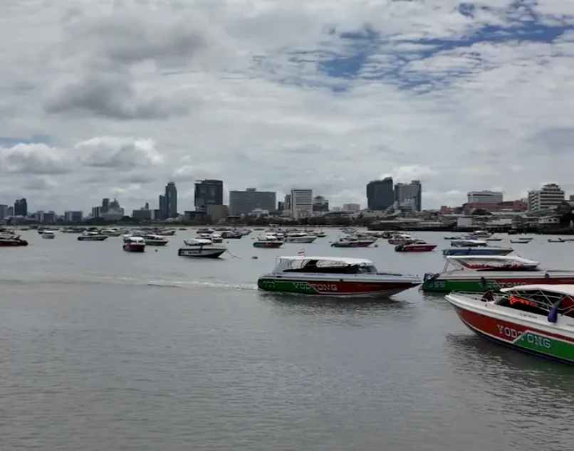 A beautiful aerial view of Koh Larn (Coral Island) showing the white sandy beaches and turquoise water of Tawaen Beach.