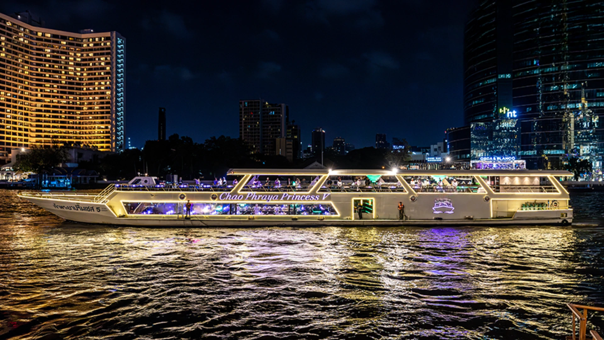 Chao Phraya dinner cruise boat on the river in Bangkok at night
