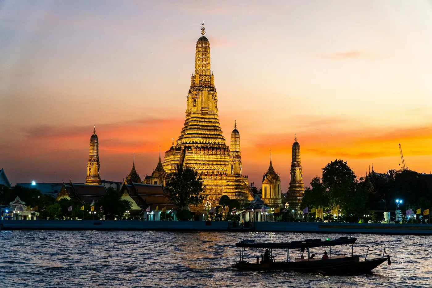 Wat Arun, the Temple of Dawn, at sunset over the Chao Phraya River