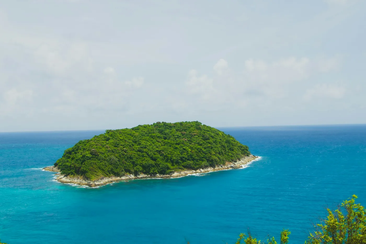Ko Man island in turquoise water seen from Windmill Viewpoint, Phuket