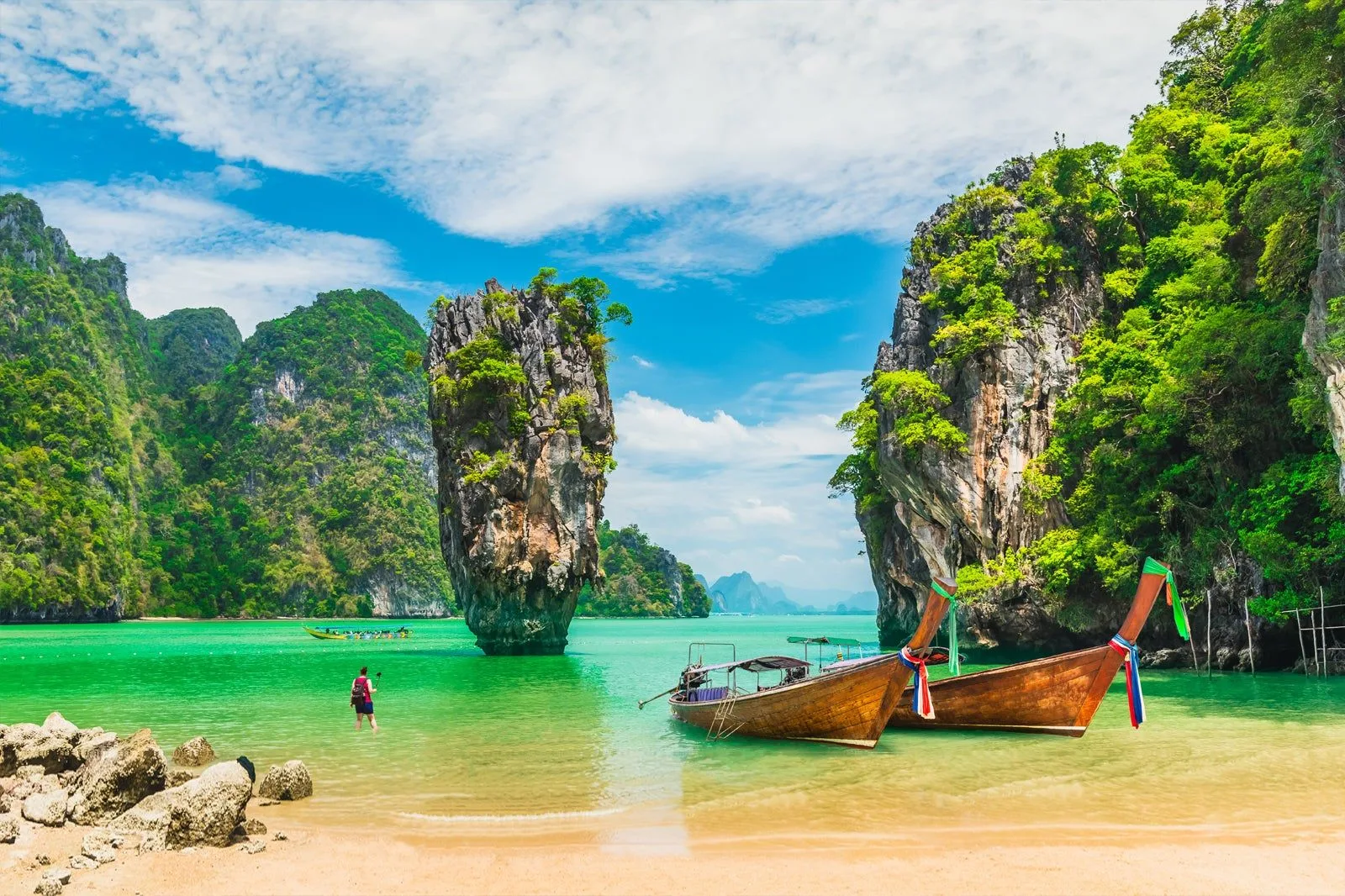 Longtail boats on the beach beside James Bond Island