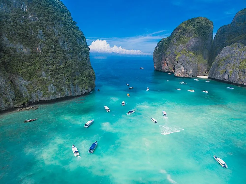Speedboats on the turquoise water of Maya Bay, Phi Phi