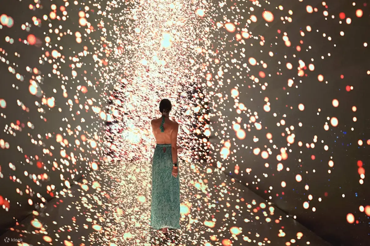 Visitor walking through a sparkling light tunnel at Space & Time Cube+ Pattaya