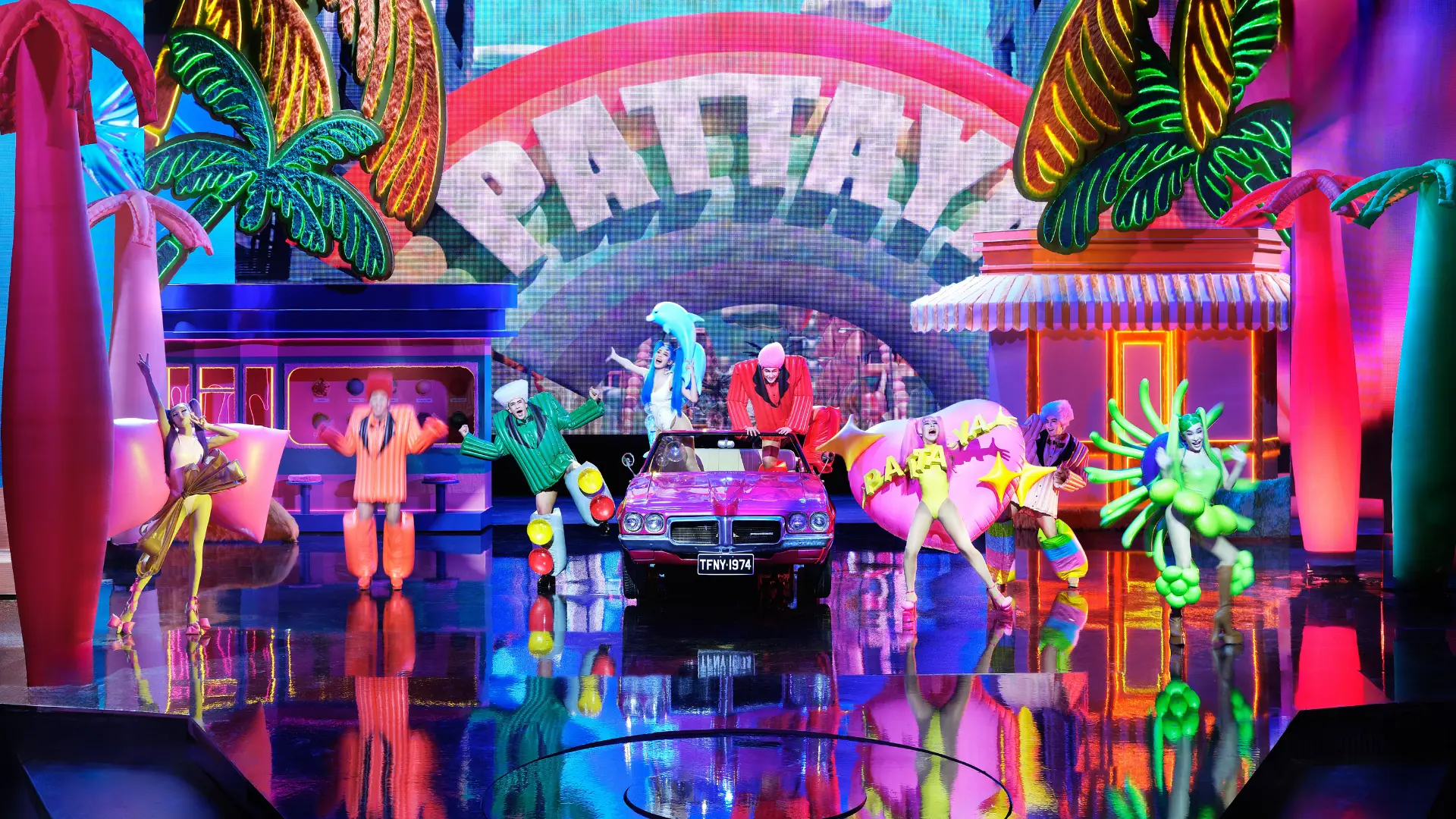 Performers in dazzling costumes on stage at Tiffany's Show Pattaya